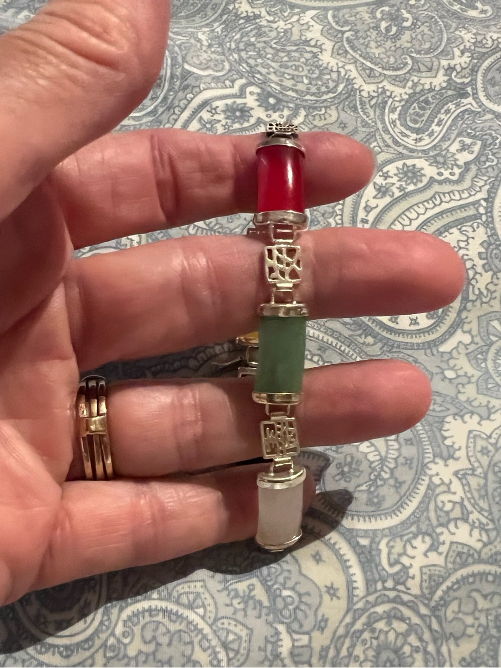 Jade faux multi-colored costume panel, silver tone bracelet, green lites with UV